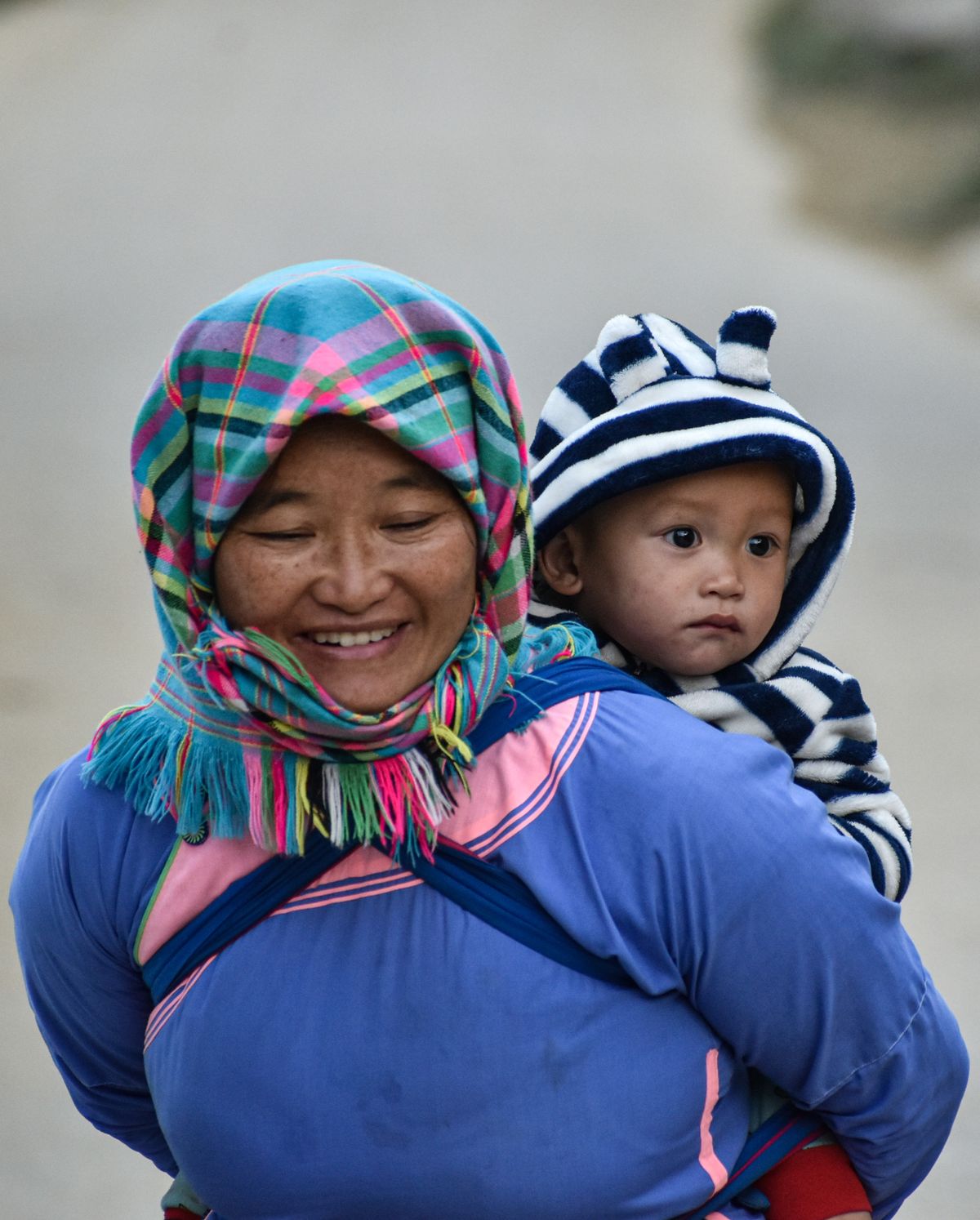 Parent wearing baby in a carrier while out and about