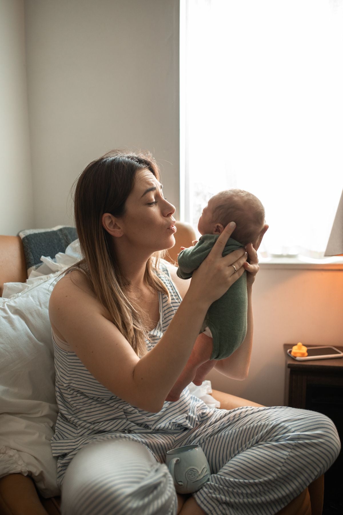 Woman experiencing postpartum hair loss after having a baby