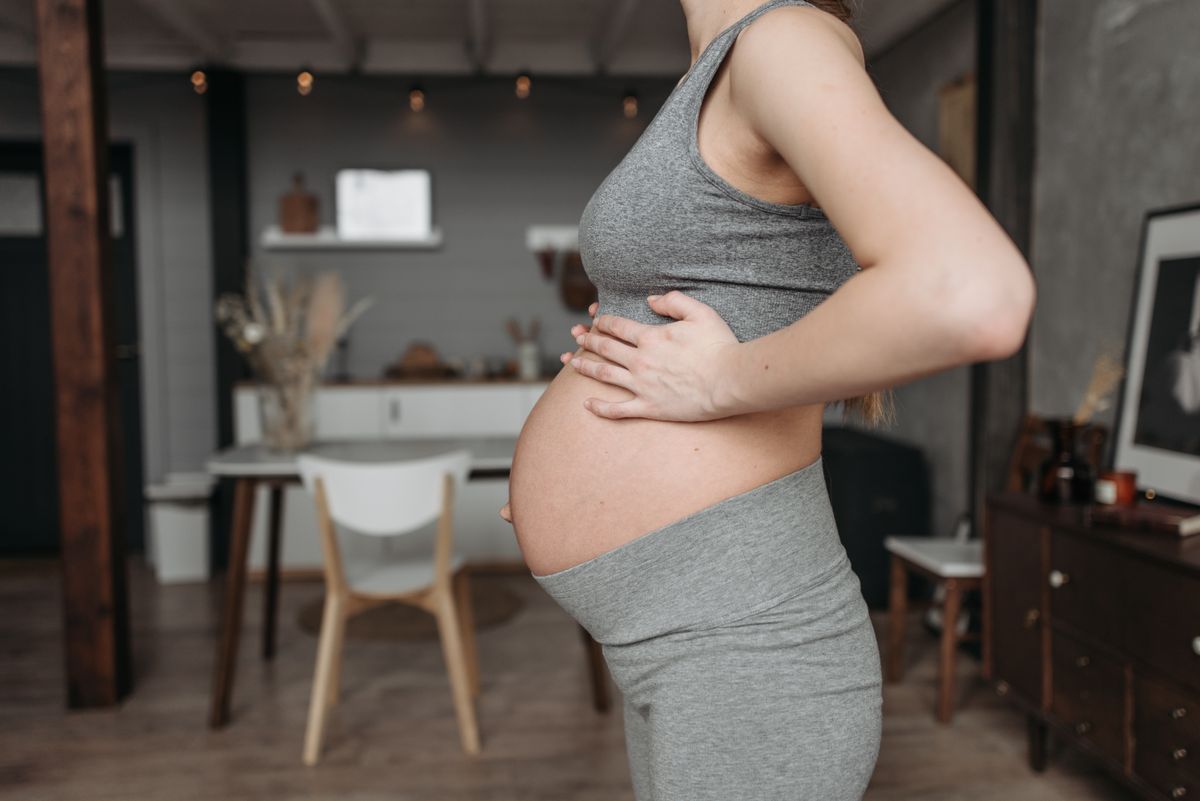 Pregnant woman resting comfortably at home during third trimester