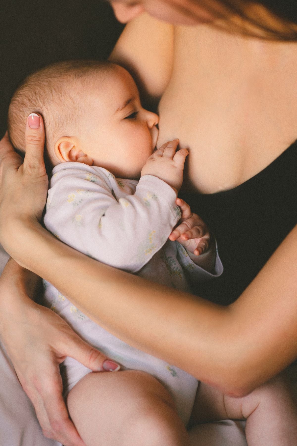 Mother breastfeeding her newborn — tips to increase breast milk supply