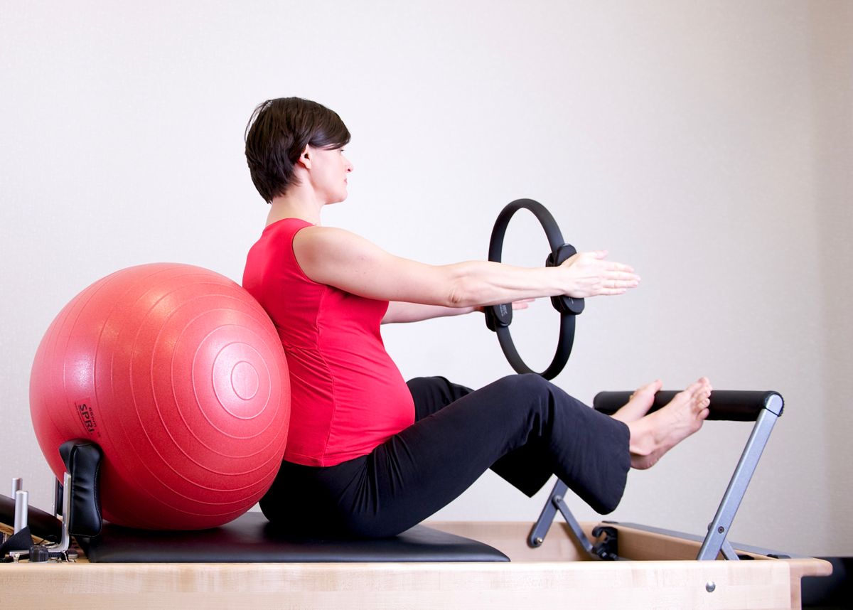 Pregnant woman feeling her baby move for the first time