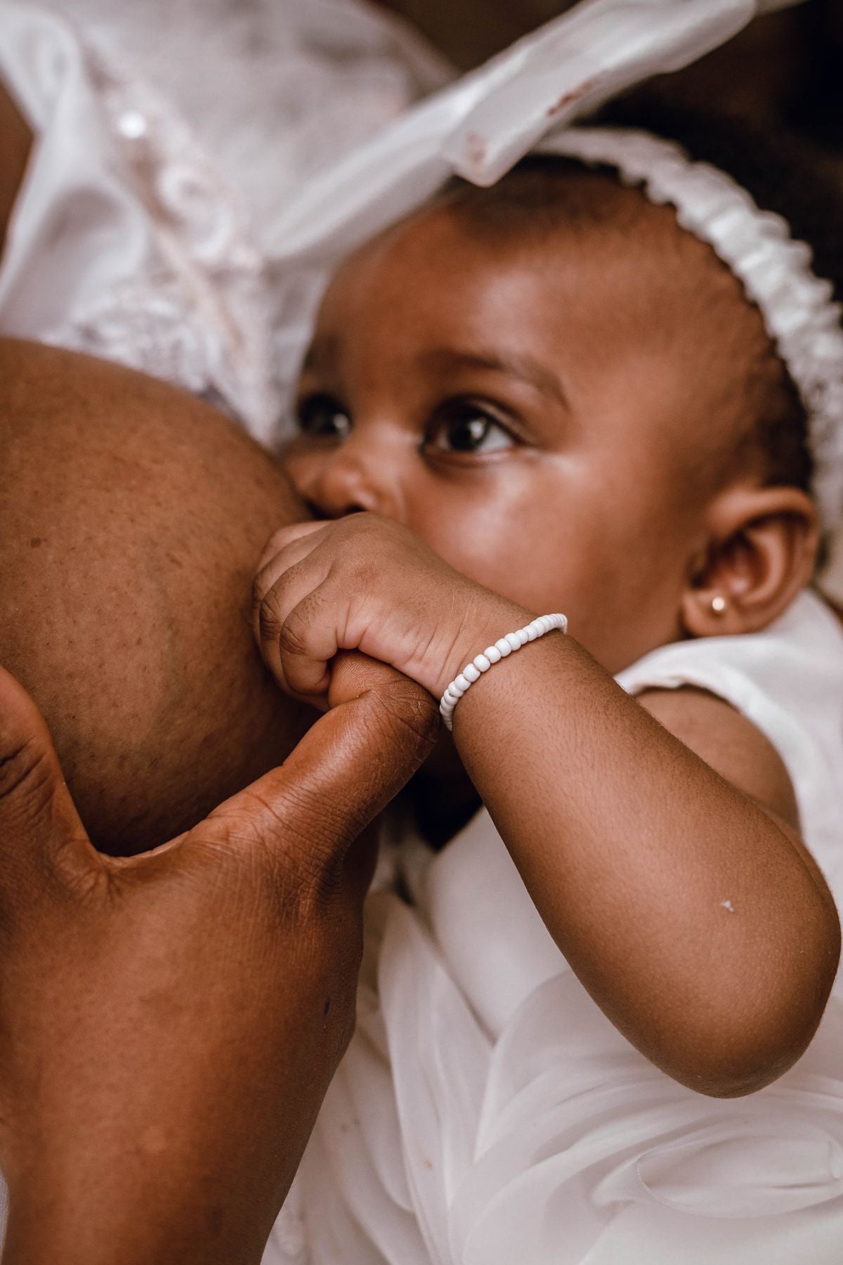 Mother breastfeeding newborn baby