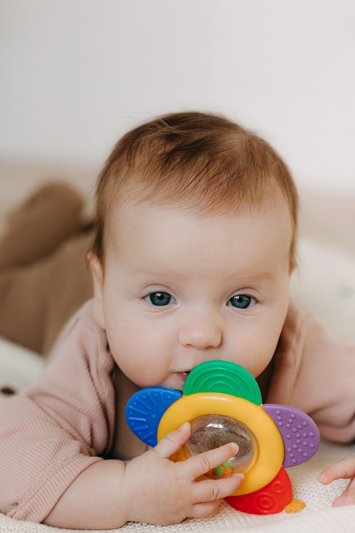 Baby enjoying a teether toy