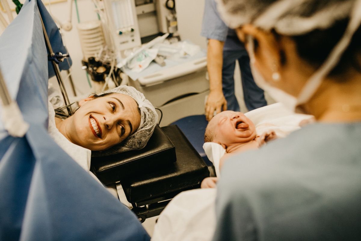 Midwife and pregnant woman during antenatal appointment