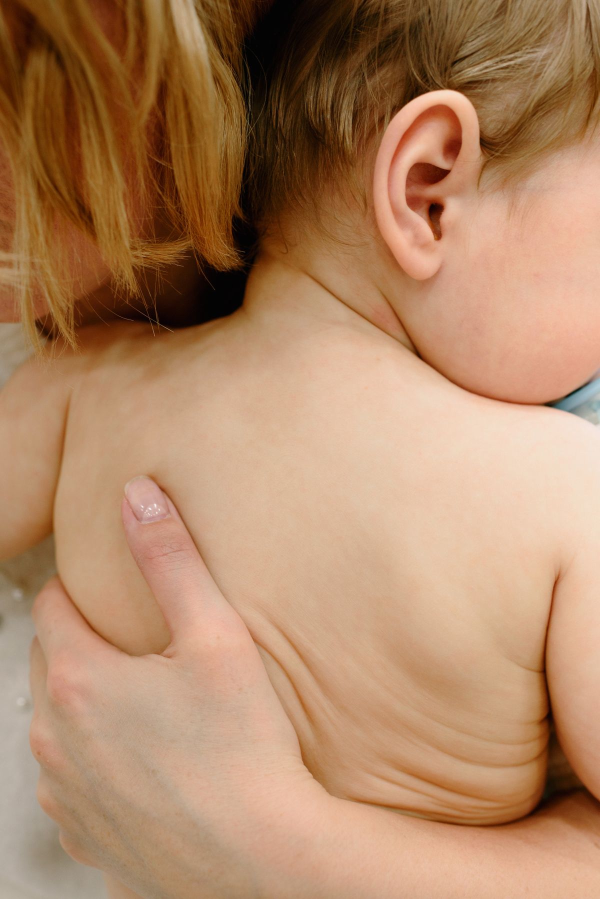 Mother doing skin-to-skin contact with newborn baby after birth