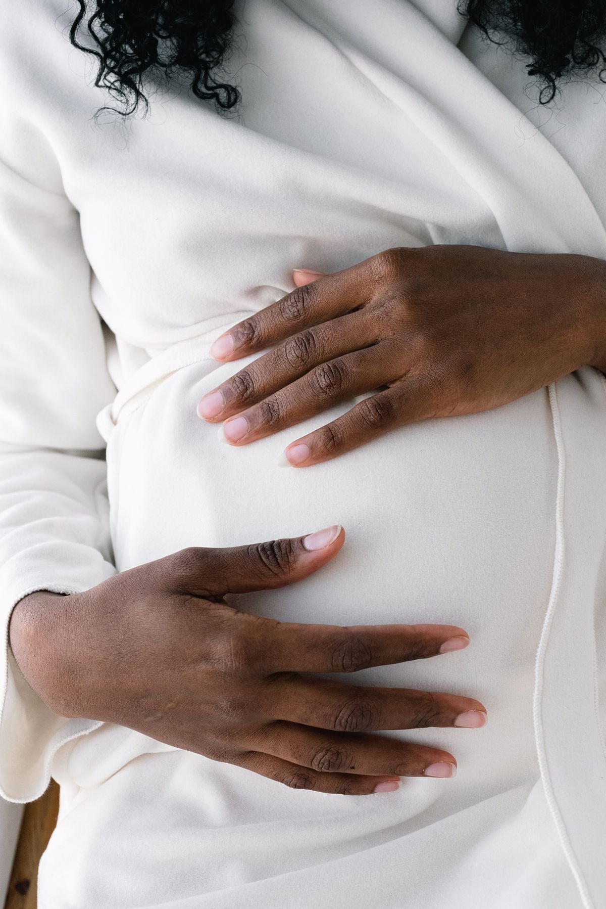 Pregnant woman at a late prenatal care appointment with healthcare provider
