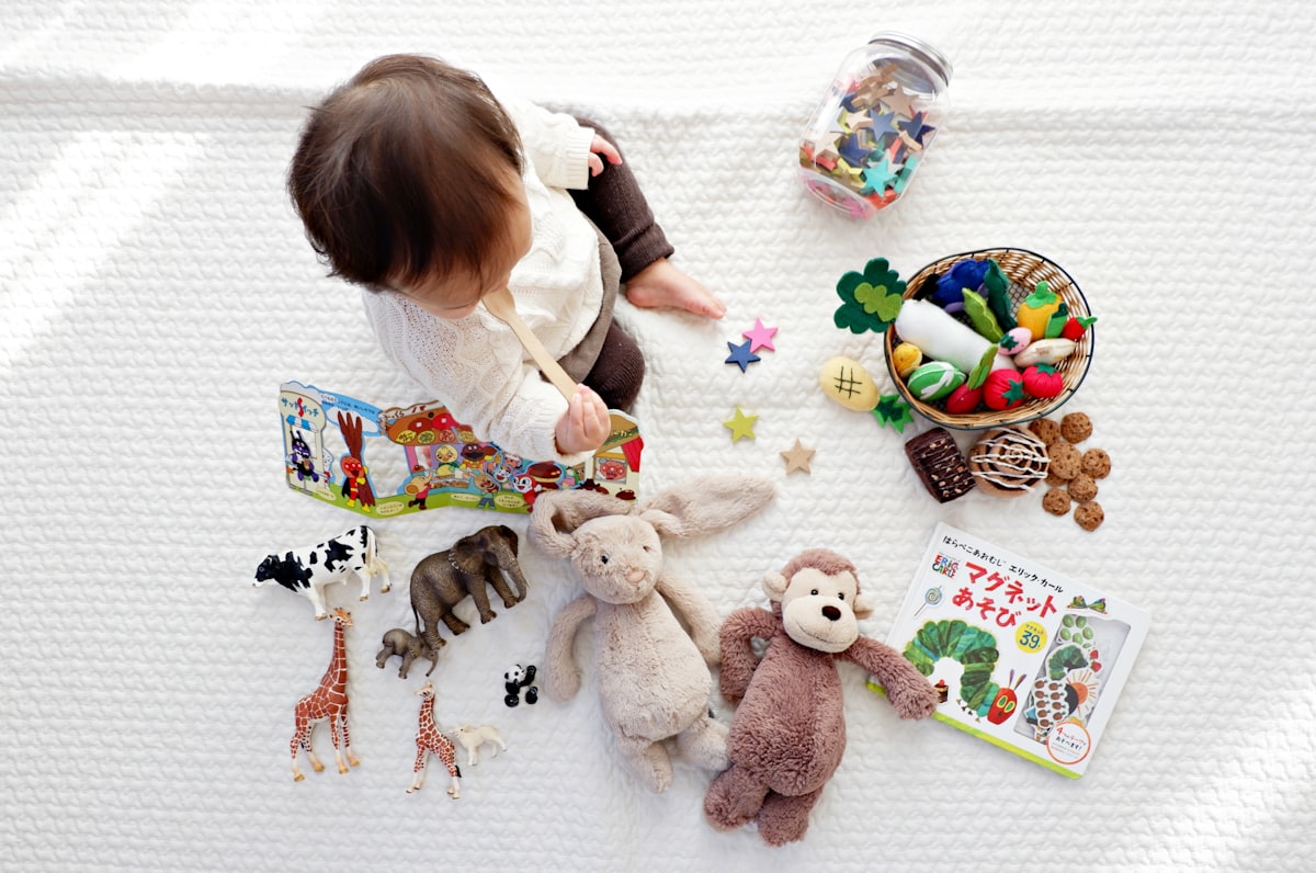 Baby playing with colourful sensory toys