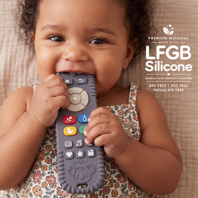 Baby chewing the remote-shaped teether from the Cream Koda Koala pair