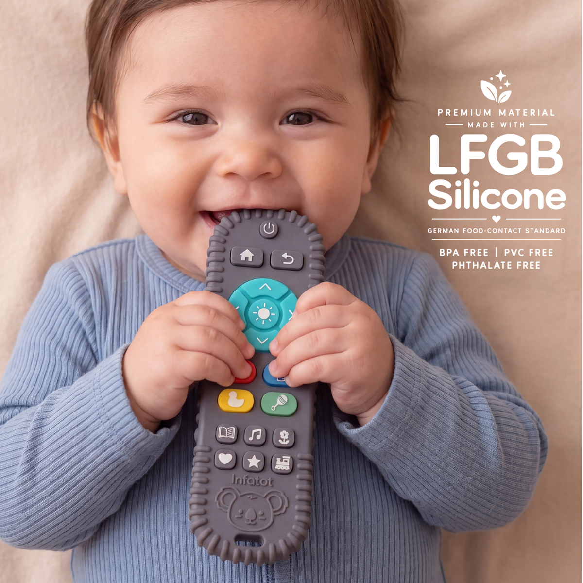 Baby chewing the remote-shaped teether from the Teal Koda Koala pair