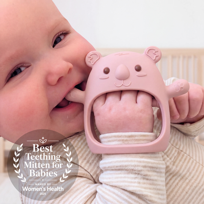 Baby wearing the Plum Koda Koala teething mitten