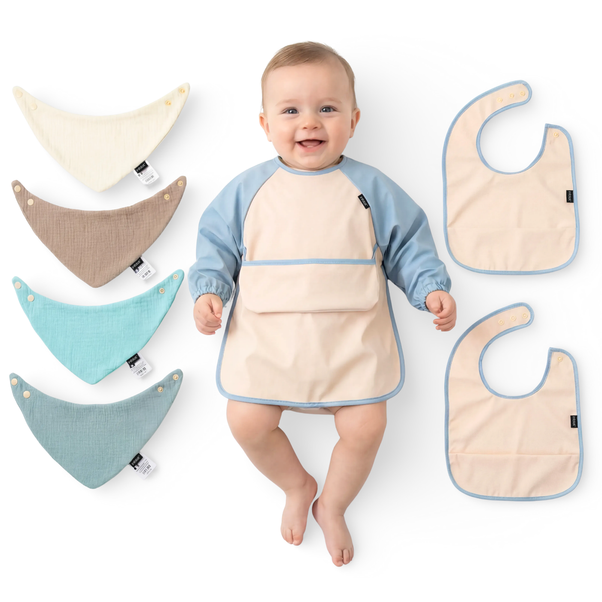 Baby wearing the blue-trimmed coverall beside the four muslin bibs and two feeding bibs in the set