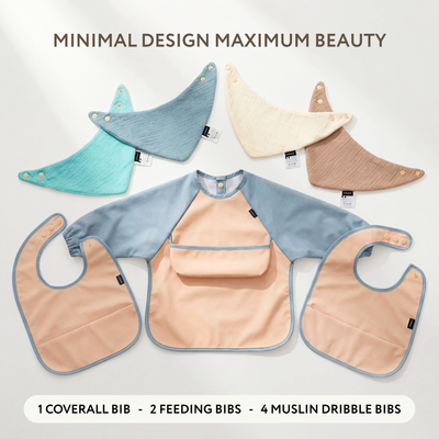 Baby Blue seven-piece bib set arranged to show the coverall, two feeding bibs and four muslin bibs